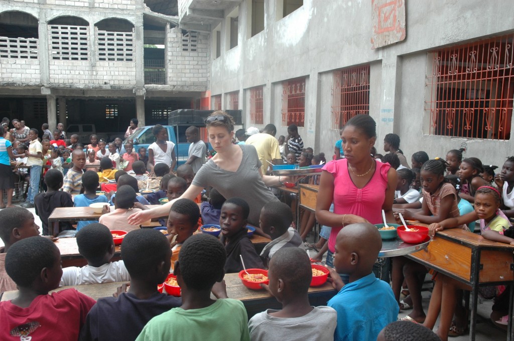 Children being fed hot lunch at CJRA school.